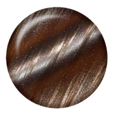 IBD Celestial Magnetic Gel swatch featuring a warm brown base with golden and champagne shimmer effects.